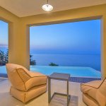Ferienhaus Korfu KOV43537 Sessel mit Blick auf Pool und Meer